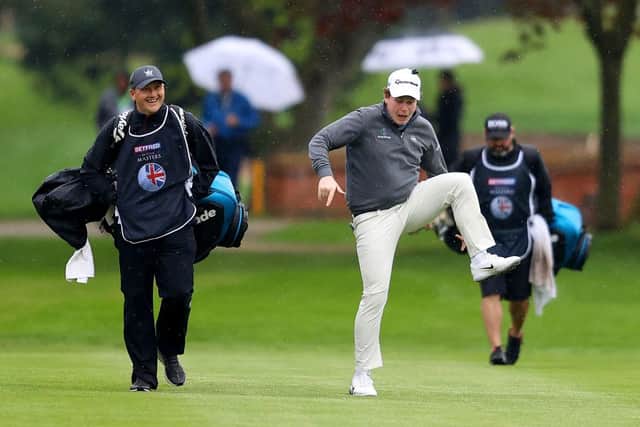 Bob Macintyre gives his caddie Mikey Thomson a laugh as he jokes around makes his way towards the 18th green during the second round of the Betfred British Masters hosted by Danny Willett at The Belfry. Picture: Picture: Richard Heathcote/Getty Images.