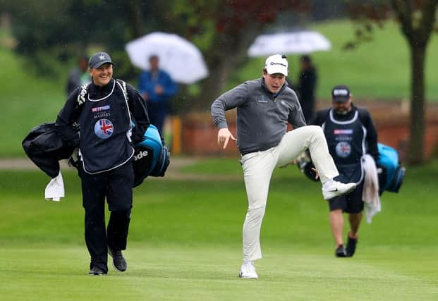 Bob Macintyre gives his caddie Mikey Thomson a laugh as he jokes around makes his way towards the 18th green during the second round of the Betfred British Masters hosted by Danny Willett at The Belfry. Picture: Picture: Richard Heathcote/Getty Images.