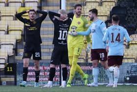 Hearts' Craig Gordon celebrates his triple save.