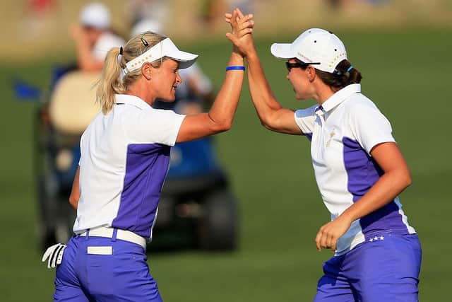 Suzann Pettersen and Carlota Ciganda winning a match during the 2013 Solheim Cup at the Colorado Golf Club. Picture: Doug Pensinger/Getty Images.