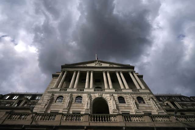 The Bank of England, above, is facing stormy economic conditions as it weighs up its next move on interest rates.
