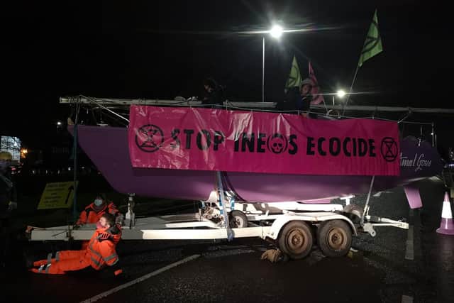 Extinction Rebellion Scotland activists lock themselves to boats used to block access to Ineos at Grangemouth picture: Extinction Rebellion