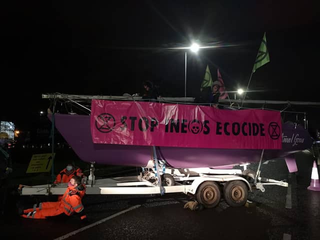 Extinction Rebellion Scotland activists lock themselves to boats used to block access to Ineos at Grangemouth picture: Extinction Rebellion