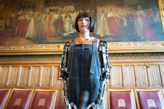 Ai-Da Robot poses for pictures in the Houses of Parliament