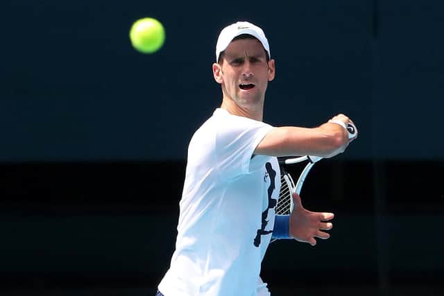 Novak Djokovic takes part in a training session in Melbourne ahead of the Australian Open tennis tournament on January 11, a day after a court overturned the Australian government's decision to cancel his visa on Covid-19 vaccination grounds. (Photo by KELLY DEFINA/POOL/AFP via Getty Images)