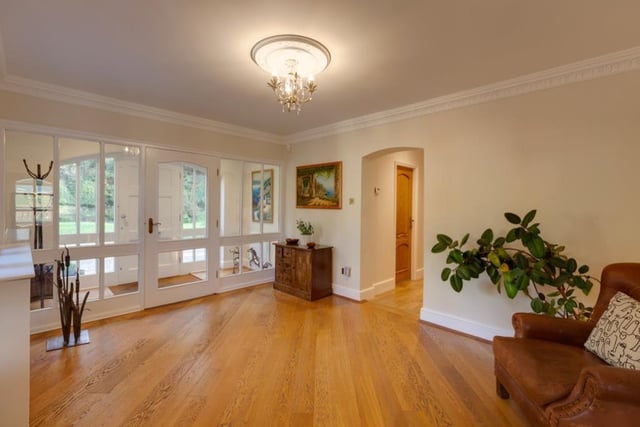 Natural light floods into the entrance hall where there are decorative ceiling roses and oak doors opening to the living kitchen,  cloakroom/wc and inner hallway.