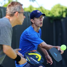 Players compete in the amateur men's doubles during the APP Chicago Open (Photo by Michael Reaves/Getty Images)