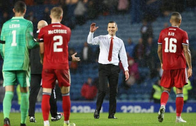 Aberdeen manager Stephen Glass greets his players at full-time after the 2-2 draw against Rangers at Ibrox. (Photo by Alan Harvey / SNS Group)
