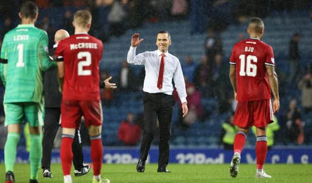 Aberdeen manager Stephen Glass greets his players at full-time after the 2-2 draw against Rangers at Ibrox. (Photo by Alan Harvey / SNS Group)