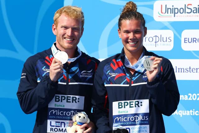 Britain's James Heatly and Grace Reid with their silver medals on the podium after the Mixed 3M Springboard final at the European Aquatics Championships in Rome . Picture: Clive Rose/Getty