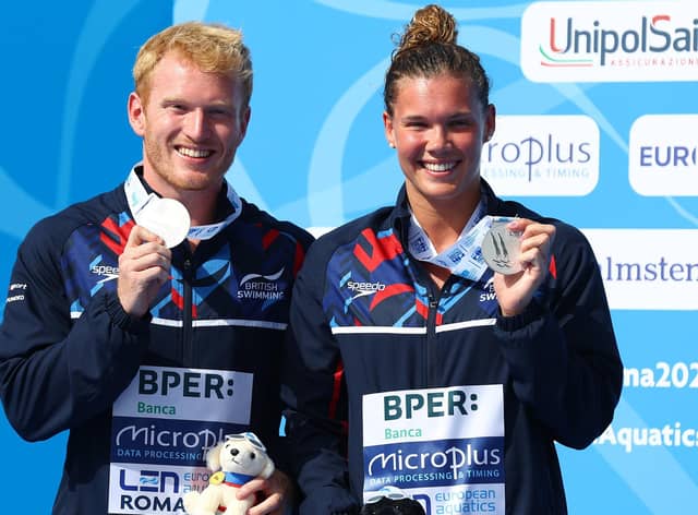 Britain's James Heatly and Grace Reid with their silver medals on the podium after the Mixed 3M Springboard final at the European Aquatics Championships in Rome . Picture: Clive Rose/Getty