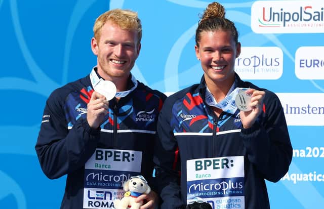 Britain's James Heatly and Grace Reid with their silver medals on the podium after the Mixed 3M Springboard final at the European Aquatics Championships in Rome . Picture: Clive Rose/Getty