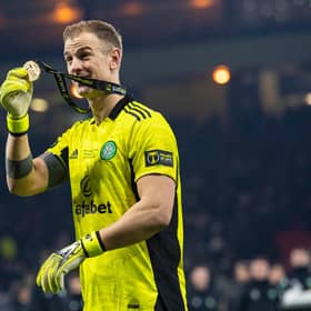 Celtic goalkeeper Joe Hart shows off his winner's medal after the Premier Sports Cup victory over Hibs.