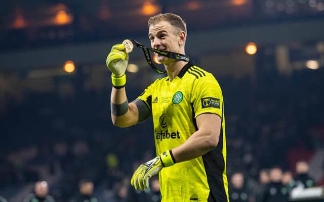 Celtic goalkeeper Joe Hart shows off his winner's medal after the Premier Sports Cup victory over Hibs.