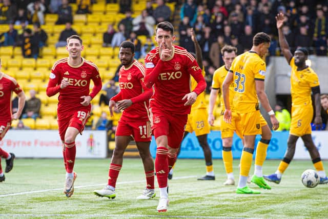 Aberdeen's Bojan Miovski celebrates scoring a late winner at Livingston before it was ruled offside by VAR. (Photo by Sammy Turner / SNS Group)