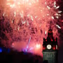 Fireworks explode over Edinburgh Castle and the Balmoral Hotel during Edinburgh's Hogmanay celebrations. Picture: Jane Barlow/PA Wire