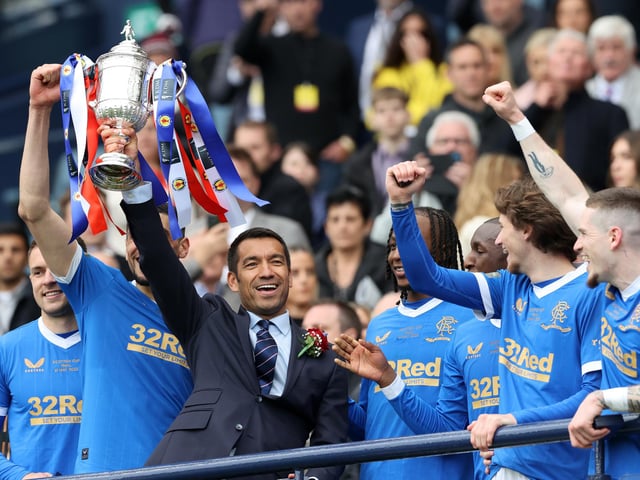 Rangers manager Giovanni van Bronckhorst lifts the Scottish Cup