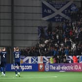 Scotland take the acclaim of the fans at full time in Torshavn.