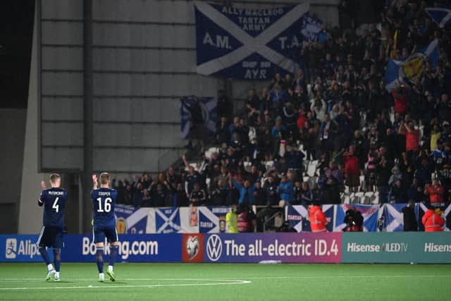 Scotland take the acclaim of the fans at full time in Torshavn.