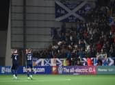 Scotland take the acclaim of the fans at full time in Torshavn.