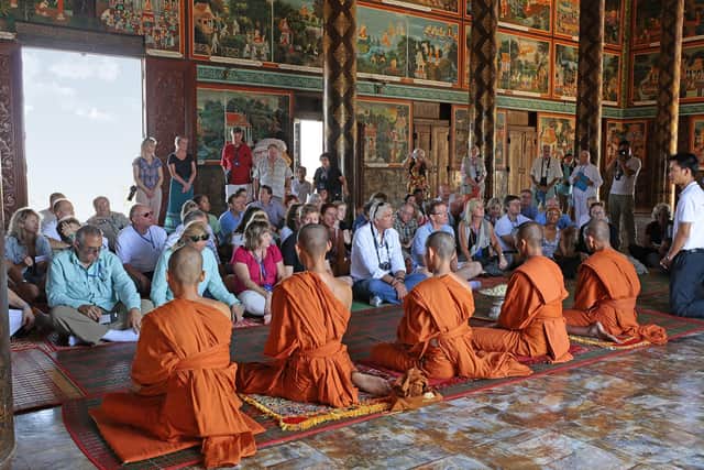 A Buddist blessing ceremony inside Oudong monastery. Image: Michael Verdure