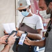 People have their Covid 'passport' checked before they enter a cinema in Paris (Picture: Alain Jocard/AFP via Getty Images)
