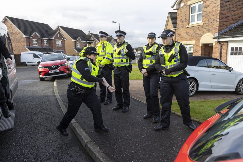 Officers from Police Scotland outside the home of former chief executive of the Scottish National Party (SNP) Peter Murrell, in Uddingston, Glasgow, after he was "released without charge pending further investigation", after he was arrested on Wednesday as part of a probe into the party's finances.