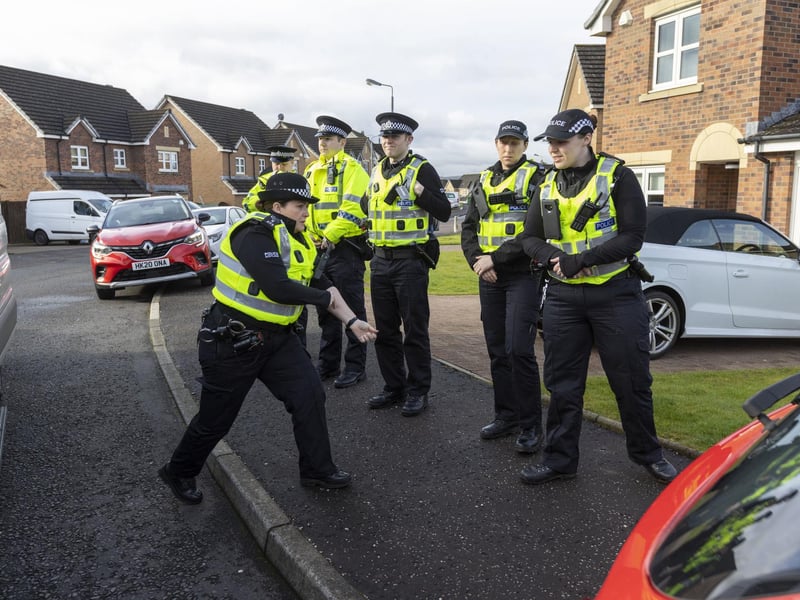Officers from Police Scotland outside the home of former chief executive of the Scottish National Party (SNP) Peter Murrell, in Uddingston, Glasgow, after he was "released without charge pending further investigation", after he was arrested on Wednesday as part of a probe into the party's finances.