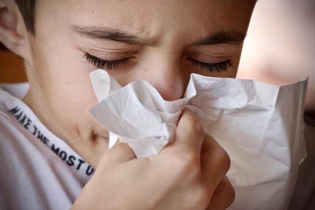 One scientist has advised that the Government add a sore throat, headache, and runny nose to the official list of Covid symptoms.
