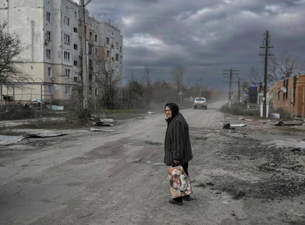 An old woman walks in the Kherson region village of Arkhanhelske, which was formerly occupied by Russian forces. Picture: Bulent Kilic/AFP via Getty Images