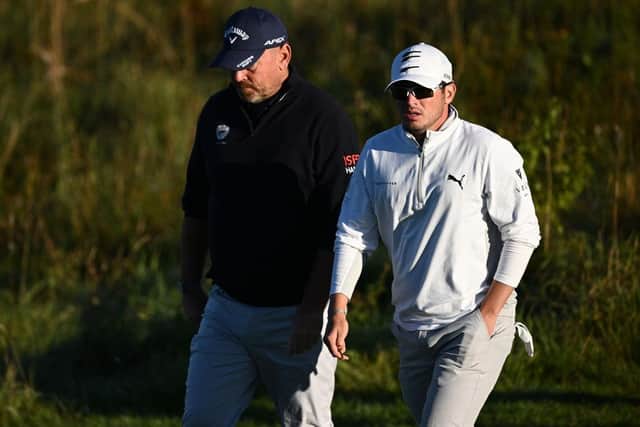 Ewen Ferguson walks with Thomas Bjorn during the first round of the Made in HimmerLand at Himmerland Golf & Spa Resort. Picture: Stuart Franklin/Getty Images.