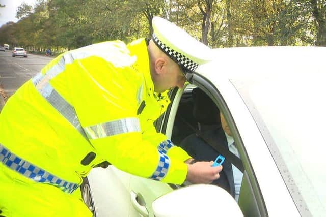 A motorist has their drug test results explained. (Pic: BBC Scotland)