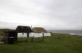 General view of a thatched cottage on the coast on the isle of Tiree off the west coast of Scotland (pic: Andrew Milligan)