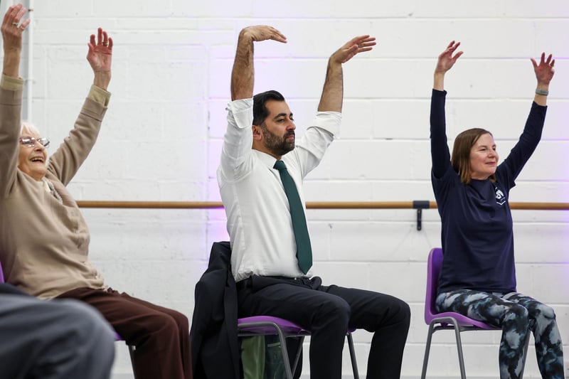 Humza Yousa, takes part in a dance performance during a visit to the Edinburgh Community Performing Arts re-connect project