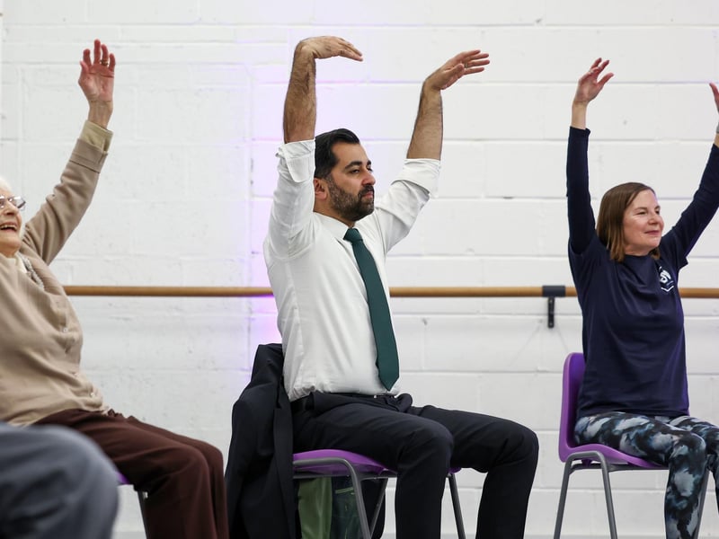 Humza Yousa, takes part in a dance performance during a visit to the Edinburgh Community Performing Arts re-connect project