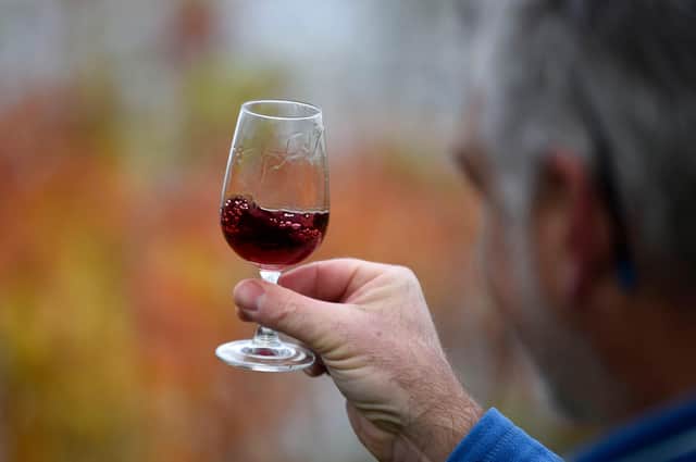 Ironically, conversations about alcohol can often take place with glasses in the hands of the participants (Picture: Daniel Leal-Olivas/AFP via Getty Images)