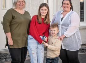 Osprey Housing Officer Elaine Sutherland (left) with new Inchmarlo residents Teresa Cruickshank, her daughter Millie, 10, and five-year-old son William.