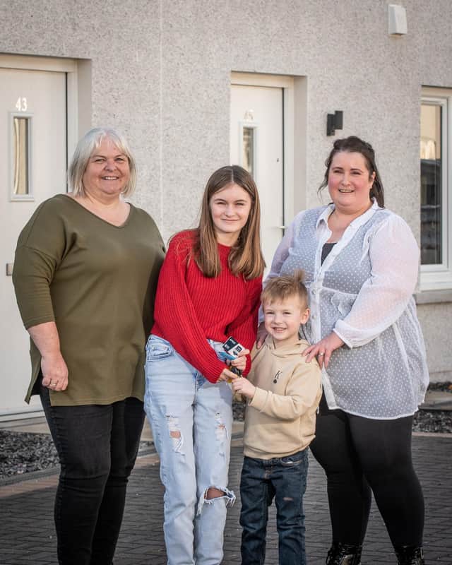 Osprey Housing Officer Elaine Sutherland (left) with new Inchmarlo residents Teresa Cruickshank, her daughter Millie, 10, and five-year-old son William.