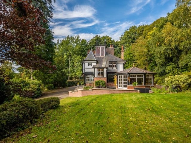 Exterior: The villa is surrounded by mature trees and its secluded grounds include an outdoor seating area and access to the Old Royal Deeside railway route.
Contact: Yvette Helps at Re/Max Coast and Country