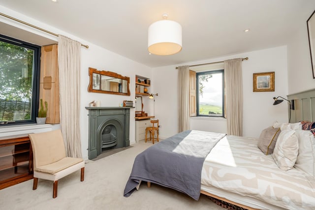 Exterior: There is a gravel driveway with an electric vehicle charging station, and the picturesque grounds are surrounded by mature trees. Sliding doors in the home extension open to a sizable patio seating area.
Contact: Strutt & Parker