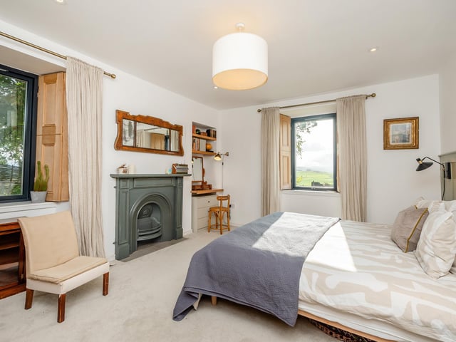 Exterior: There is a gravel driveway with an electric vehicle charging station, and the picturesque grounds are surrounded by mature trees. Sliding doors in the home extension open to a sizable patio seating area.
Contact: Strutt & Parker