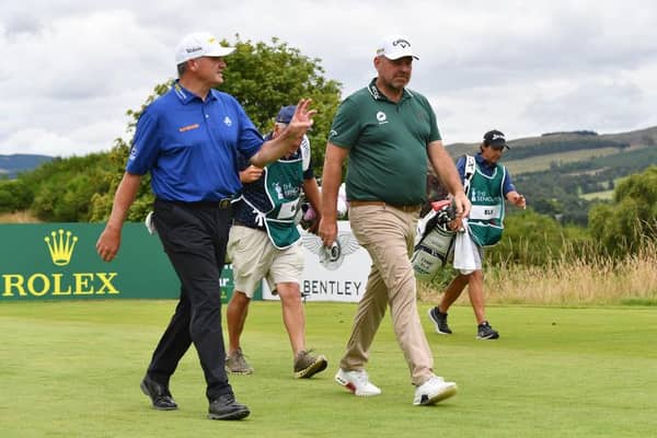 Paul Lawrie and Thomas Bjorn walk up the third hole on the King's Course in the first round of The Senior Open Presented by Rolex at Gleneagles. Picture: Mark Runnacles/Getty Images.