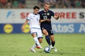 Scotland defender Ryan Porteous challenges Cyprus midfielder Charalampos Charalampous. (Photo by Ryan Pierse/Getty Images)