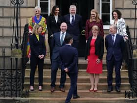 Michael Matheson, Secretary for NHS Recovery, Health and Social Care, front right, with the Cabinet on the steps of Bute House