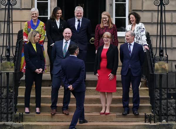 Michael Matheson, Secretary for NHS Recovery, Health and Social Care, front right, with the Cabinet on the steps of Bute House