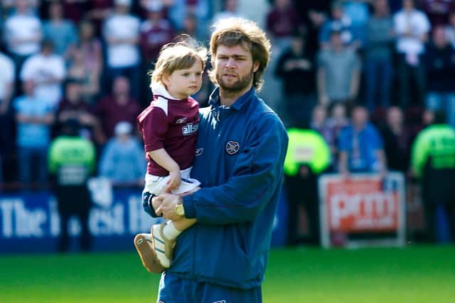 Aaron on the Tynecastle Park pitch with dad Steven Pressley who was Hearts captain. Picture: SNS