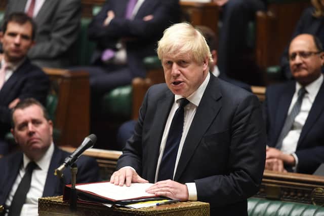 Prime Minister Boris Johnson in Parliament. (Photo by JESSICA TAYLOR/UK PARLIAMENT/AFP via Getty Images)