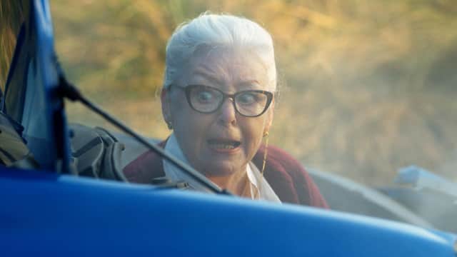 'Gran' climbing out of the crashed car in the advert