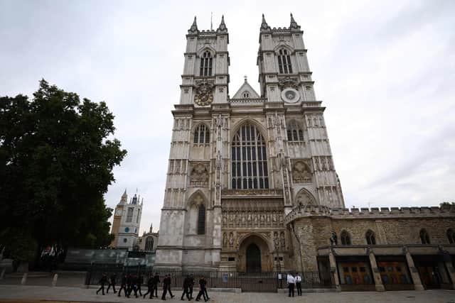 Police officers patrol outside Westminster Abbey in London on September 19, 2022, ahead of the State Funeral Service for Britain's Queen Elizabeth II.
