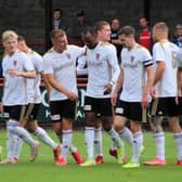 All 10 outfield players celebrate Julian Wade's equaliser. (Photo: Ian Rennie)